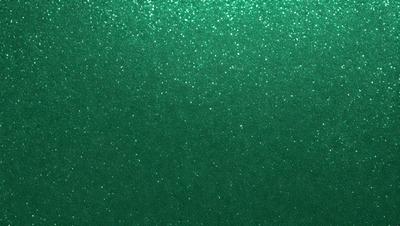 The primary subject of the image is a green wall with a glittery, metallic texture. The setting is a room with a green background, and the visual style appears to be a photo or a digital artwork. The dominant colors are green and silver, creating a calm and soothing atmosphere.
