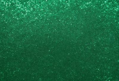 The primary subject of the image is a green background with a pattern of glittering green and white dots. The setting is a close-up of the green background, which creates a visually appealing and unique pattern. The visual style is a close-up of the green background, which emphasizes the intricate pattern of the dots. The colors and mood of the image are predominantly green, with the glittering dots adding a touch of brightness and visual interest.