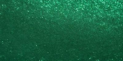 The primary subject of the image is a green background with a pattern of bright green stars. The setting appears to be a space or an artistic environment. The visual style is a combination of a photo and digital art, creating a unique and captivating appearance. The dominant colors are green, and the overall atmosphere is vibrant and lively.