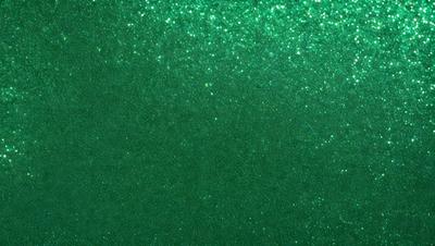 The primary subject of the image is a green background with a pattern of glittering stars. The setting is a dark room, and the visual style appears to be a digital art or illustration. The dominant colors are green and white, creating a calm and serene atmosphere.