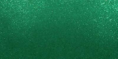 The primary subject of the image is a green background with a pattern of glittering stars. The setting is a dark room, and the visual style appears to be a digital art or illustration. The dominant colors are green and white, creating a calm and serene atmosphere.