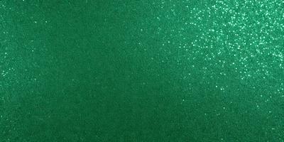 The primary subject of the image is a green wall with a pattern of glittery green stars. The setting is a room with a green background, and the visual style appears to be a digital art or illustration. The dominant colors are green and glittery, creating a lively and vibrant atmosphere.