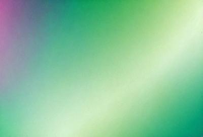 The primary subject of the image is a green background. The setting is a wall, and the visual style is a photo. The colors and mood of the image are predominantly green, creating a calm and soothing atmosphere.