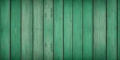 The primary subject of the image is a green wooden wall with a pattern of holes. The setting is a room with a green wall, and the visual style is a close-up of the wall. The dominant colors are green and brown, creating a warm and natural atmosphere.