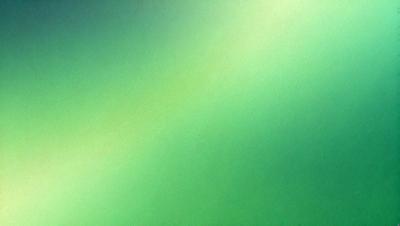 The primary subject of the image is a green background. The setting is a brightly lit room, and the visual style is a photo. The colors and mood of the image are predominantly green, creating a calm and soothing atmosphere.