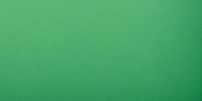 The primary subject of the image is a large, bright green surface. The setting is a plain, empty space with no visible objects or background. The visual style is a close-up of the green surface, which appears to be a piece of fabric or a wall. The colors and mood of the image are predominantly green, creating a calm and serene atmosphere.
