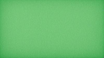 The primary subject of the image is a green background. The setting is a large, unoccupied space with a green surface. The visual style is a close-up of the green background, which gives the image a clean and simple appearance. The colors and mood of the image are predominantly green, creating a calm and serene atmosphere.