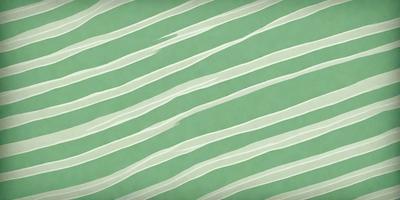 The image features a green and white striped pattern, which gives it a vibrant and lively appearance. The primary subject of the image is the striped pattern, which is the main focus of the image. The setting or background of the image is a green and white striped surface, which adds to the overall visual style of the image. The colors and mood of the image are predominantly green and white, creating a sense of freshness and energy.