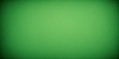 The primary subject of the image is a large, bright green background. The setting is a plain, uncluttered space with no visible objects or people. The visual style is a close-up of the green background, which gives a sense of depth and focus to the image. The colors and mood are predominantly green, creating a calm and serene atmosphere.