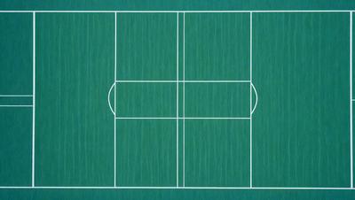The image features a green tennis court with a white outline. The court is surrounded by a blue background, giving it a vibrant and lively appearance. The tennis court is the primary subject of the image, and it is depicted in a realistic manner, likely as a photo or a digital art piece. The colors and mood of the image are energetic and dynamic, with the green and white tennis court standing out against the blue background.