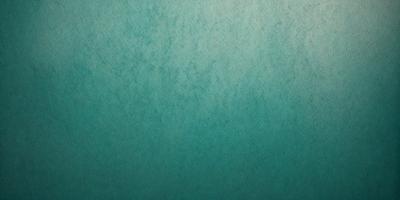 The primary subject of the image is a blue wall with a textured surface. The setting is a room with a blue wall, and the visual style is a close-up of the wall. The dominant colors are blue and green, creating a calm and soothing atmosphere.