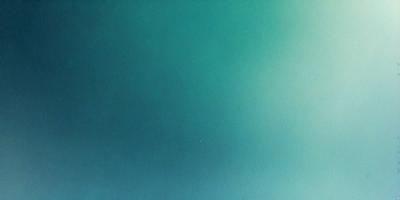 The primary subject of the image is a large, dark blue surface. The setting is a vast, open space with no visible objects or people. The visual style is a close-up of the blue surface, which gives the impression of a deep, dark ocean. The colors and mood of the image are predominantly dark and moody, with the blue surface creating a sense of depth and mystery.