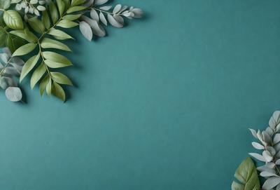 The primary subject of the image is a green leafy plant, which is prominently displayed in the foreground. The setting is a blue wall, which serves as the background for the plant. The visual style of the image is a photo, capturing the natural beauty of the plant. The colors in the image are predominantly green, with the blue wall providing a contrasting backdrop. The overall atmosphere of the image is serene and calming, with the plant serving as a focal point and symbol of nature.