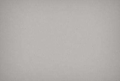 The primary subject of the image is a white wall with a few dots on it. The setting is a room with a plain white background. The visual style is a simple, clean design. The colors are predominantly white, and the mood is calm and minimalistic.