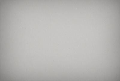 The primary subject of the image is a large, white wall. The setting is a plain, empty room with no other objects or people visible. The visual style is a simple, clean, and minimalist design. The colors and mood are predominantly neutral, with a sense of emptiness and simplicity.