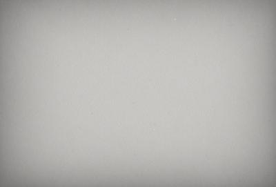 The image is a white background with a few white dots scattered across it. The primary subject is the white background, which serves as a clean and uncluttered surface. The setting is a plain white wall, and the visual style is a simple, minimalist design. The colors and mood are predominantly white, creating a calm and serene atmosphere.