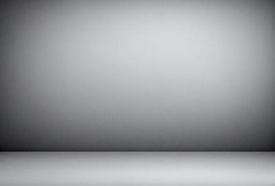 The primary subject of the image is a large, empty white wall. The setting is a plain, white room with no other objects or decorations visible. The visual style is a simple, clean, and minimalist design. The colors and mood are predominantly white, creating a sense of emptiness and simplicity.