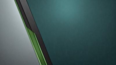 The primary subject of the image is a green and black wall. The setting is a dark room with a green and black wall. The visual style is a close-up of the wall, and the colors and mood are dark and moody.