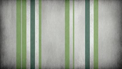 The primary subject of the image is a white wall with green stripes. The setting is a room with a white wall, and the visual style is a photo. The dominant colors are white and green, creating a calm and soothing atmosphere.