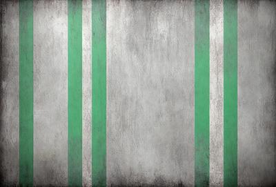 The primary subject of the image is a wall with a green and white striped pattern. The setting is a room with a green and white striped wallpaper. The visual style is a photo of the wall. The dominant colors are green and white, creating a calm and soothing atmosphere.