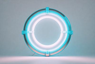 The primary subject of the image is a blue neon light, which is the main object, scene, or focus of the image. The setting is a white background, and the visual style is a photo. The colors and mood of the image are predominantly blue, creating a cool and modern atmosphere.