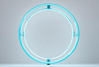 The primary subject of the image is a blue circle light, which is the main object in the scene. The setting is a white background, and the visual style is a photo. The dominant colors in the image are blue and white, creating a calm and soothing atmosphere.