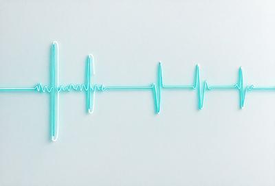 The primary subject of the image is a blue and green heartbeat line. The setting is a white background, and the visual style is a digital art or illustration. The colors and mood of the image are predominantly blue and green, creating a calm and soothing atmosphere.