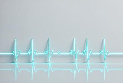 The image features a white background with a green line that resembles a heartbeat. The line is positioned horizontally across the background, creating a visually striking pattern. The primary subject of the image is the heartbeat line, which serves as the focal point and main object of the scene.