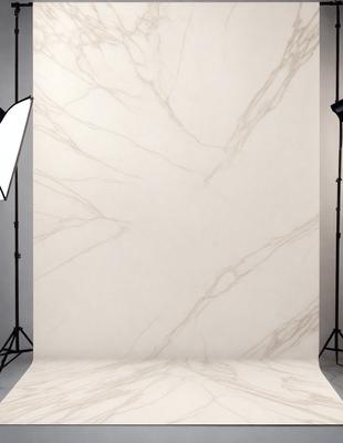 The primary subject of the image is a marble wall, which is the main object, scene, or focus of the image. The setting/background features a white marble wall, which is the primary visual element in the image. The visual style of the image is a photo, as it captures the marble wall in a realistic manner. The colors and mood of the image are predominantly white, giving it a clean and elegant appearance.