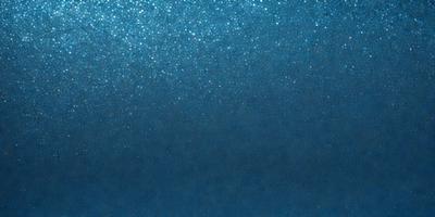 The primary subject of the image is a blue ocean with a clear sky above. The setting is a vast expanse of water, and the background features a beautiful blue color. The visual style of the image is a photo, capturing the natural beauty of the ocean and sky. The colors and mood of the image are serene and calming, with the blue ocean and sky creating a peaceful atmosphere.