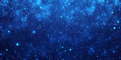 The primary subject of the image is the night sky filled with stars. The setting is a dark, star-filled background, creating a sense of depth and space. The visual style is a photo of the night sky, capturing the beauty of the stars and the vastness of the universe. The colors and mood of the image are predominantly dark and serene, with the stars providing a sense of wonder and tranquility.
