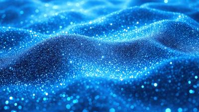The primary subject of the image is a blue surface with glittering, sparkling blue lights. The setting appears to be a blue ocean or a blue-lit room. The visual style is a close-up of the blue surface, which creates a captivating and mesmerizing effect. The colors and mood of the image are predominantly blue, creating a serene and calming atmosphere.