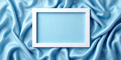 The primary subject of the image is a white frame with a blue background. The setting is a blue fabric, which serves as the backdrop for the frame. The visual style is a combination of a photo and digital art, as the frame appears to be a photograph with a blue background, while the blue fabric adds a digital art touch to the scene. The colors and mood of the image are predominantly blue, creating a calm and serene atmosphere.