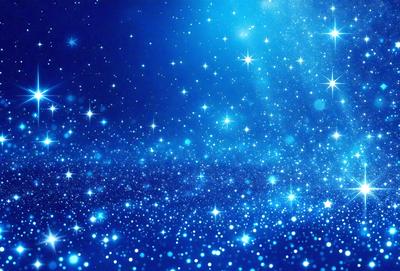 The primary subject of the image is a bright blue sky filled with stars. The setting is a night sky, and the visual style is a photo. The colors and mood of the image are predominantly blue, with a sense of wonder and tranquility.
