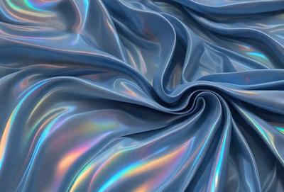 The primary subject of the image is a blue fabric with a metallic sheen, giving it a shimmering and reflective appearance. The setting is a blue background, which complements the blue fabric. The visual style is a close-up of the fabric, showcasing its unique texture and color. The colors and mood of the image are predominantly blue, creating a calm and serene atmosphere.