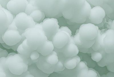 The primary subject of the image is a cloudy, white, and green mass of clouds. The setting is a sky filled with these clouds, creating a visually striking and dynamic scene. The visual style of the image is a combination of photo and digital art, as it captures the beauty and intricacy of the cloud formations. The colors and mood of the image are predominantly white and green, with a hint of blue, giving it a serene and calming atmosphere.