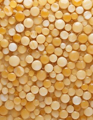 The primary subject of the image is a close-up of a beige or tan colored surface, which appears to be a patterned or textured material. The setting is a room with a wall, and the visual style is a close-up of the material. The colors and mood of the image are warm and inviting, with the beige or tan color creating a sense of comfort and relaxation.
