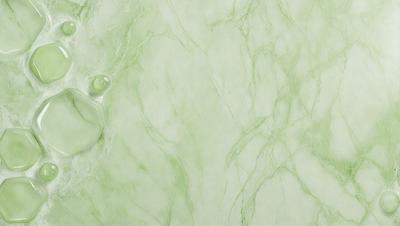 The primary subject of the image is a green marble wall. The setting is a bathroom, with the marble wall being the main focus of the scene. The visual style is a photo, capturing the natural texture and color of the marble. The colors and mood of the image are predominantly green, creating a serene and calming atmosphere.