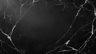 The primary subject of the image is a black marble countertop. The setting is a dark room, and the visual style is a close-up of the marble countertop. The countertop appears to be a dark grey color, giving it a sophisticated and elegant appearance.