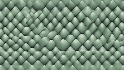 The primary subject of the image is a green, textured wallpaper with a patterned design. The setting is a room with a green wall, and the visual style is a close-up of the wallpaper. The colors and mood of the image are predominantly green, creating a calm and soothing atmosphere.