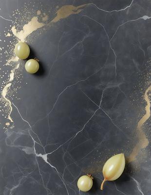 The primary subject of the image is a close-up of a couple of grapes on a black marble countertop. The setting is a kitchen or dining area, with the marble countertop serving as the background. The visual style is a realistic photo, capturing the details of the grapes and the countertop. The colors in the image are predominantly black and white, with the grapes being the main focus and the marble countertop providing a contrasting texture. The overall atmosphere of the image
