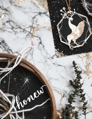 The primary subject of the image is a wooden bowl with a star pattern on it, placed on a marble countertop. The setting is a room with a marble surface, and the visual style is a combination of a photo and digital art. The colors and mood of the image are predominantly white and gold, giving it a warm and elegant atmosphere.