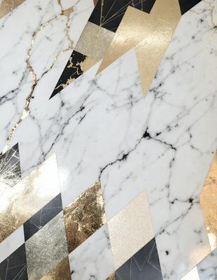 The primary subject of the image is a marble surface with a gold pattern. The setting is a room with a white marble wall, and the visual style is a combination of photo and digital art. The dominant colors are gold and white, creating a luxurious and elegant atmosphere.