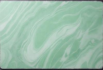 The primary subject of the image is a large, green, swirling pattern. The setting is a wall, and the visual style is a digital art or illustration. The dominant colors are green and blue, creating a calm and soothing atmosphere.