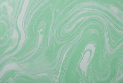 The primary subject of the image is a green and white swirling pattern, which appears to be a painting or a digital artwork. The setting is a wall, and the visual style is a combination of photo and digital art. The dominant colors are green and white, creating a calming and soothing atmosphere.