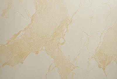 The primary subject of the image is a wall with a marble texture. The setting is a room with a white background. The visual style is a photo of a marble wall. The dominant colors are white and beige, creating a clean and elegant atmosphere.