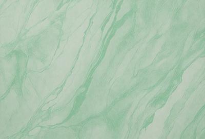 The primary subject of the image is a marble-like surface with a green tint. The setting is a bathroom, and the visual style is a photo. The dominant colors are green and white, creating a calm and soothing atmosphere.