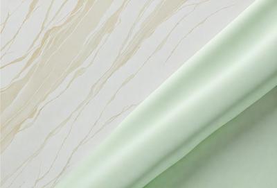 The primary subject of the image is a white and green striped wallpaper. The setting is a room with a white and green striped wallpaper. The visual style is a patterned wallpaper. The dominant colors are white and green, creating a calm and soothing atmosphere.