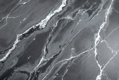 The image features a black and white marble pattern, which gives it a classic and elegant appearance. The marble pattern is the primary subject of the image, and it is set against a dark background. The visual style of the image is a close-up of the marble pattern, which highlights the intricate details of the design. The colors and mood of the image are predominantly dark, with the marble pattern being the main focus and source of visual interest.