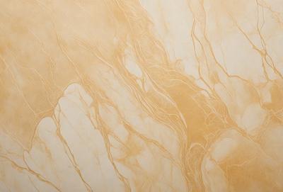 The primary subject of the image is a marble wall with a gold-colored pattern. The setting is a room with a marble floor, and the visual style is a close-up of the marble wall. The colors and mood of the image are warm and luxurious, with the gold pattern and marble materials creating an elegant and sophisticated atmosphere.